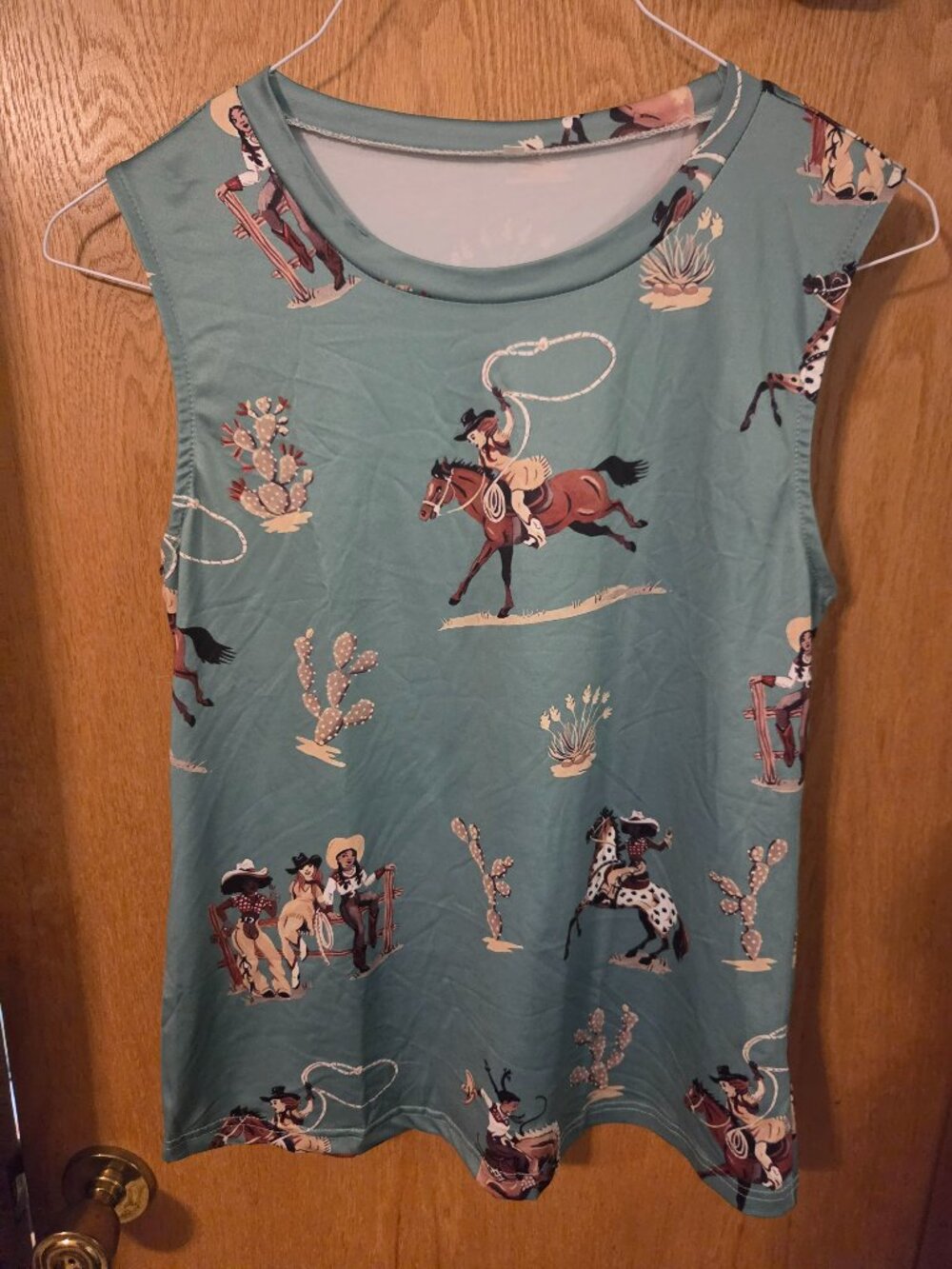 green sleeveless cowboys and horses' graphic shirt size small